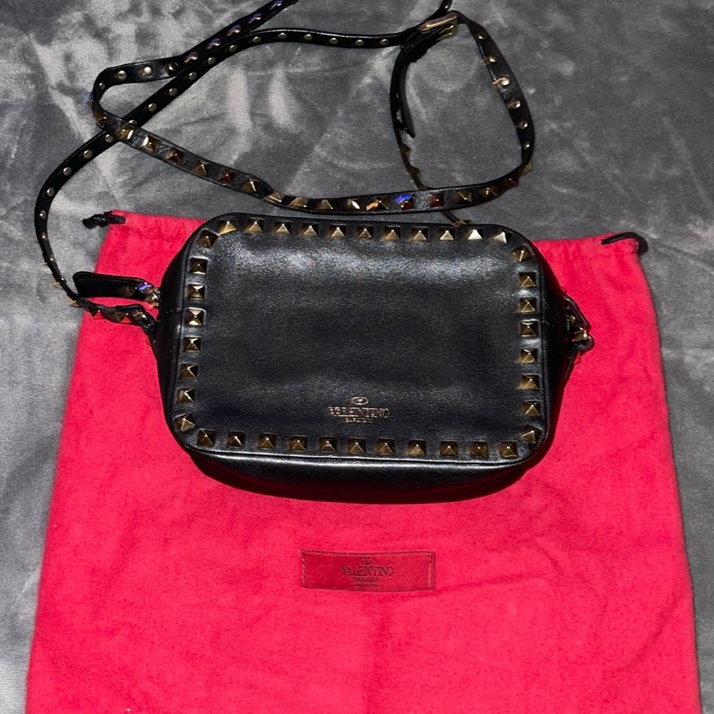 Preload Valentino, black n gold spike Crossbody excellent condition 7”X 5”.